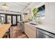 Modern kitchen featuring stainless steel appliances, custom cabinets, counter space, and tiled floor at 122 Miramar Ne Blvd, St Petersburg, FL 33704