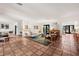 Spacious living room with terra cotta tile, ample seating, and natural light at 122 Miramar Ne Blvd, St Petersburg, FL 33704
