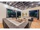 Inviting outdoor living space with comfortable seating, ambient lighting, and a serene backyard view at 122 Miramar Ne Blvd, St Petersburg, FL 33704