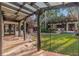 Charming outdoor patio with terracotta tile, wooden beams, and a lush garden backdrop at 122 Miramar Ne Blvd, St Petersburg, FL 33704