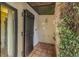 Outdoor shower with rustic wooden door, tile flooring, and lush greenery at 122 Miramar Ne Blvd, St Petersburg, FL 33704