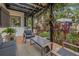 Relaxing covered patio with comfortable seating and vibrant foliage at 122 Miramar Ne Blvd, St Petersburg, FL 33704
