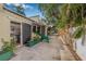 Side yard with a slide, lovely garden beds, and mature trees, offering a tranquil retreat at 122 Miramar Ne Blvd, St Petersburg, FL 33704