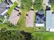 Overhead view of houses with well-maintained yards, mature trees, and quiet suburban streets at 12716 Evington Point Dr, Riverview, FL 33579