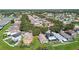 An aerial view of a neighborhood with mature trees and well-kept lawns in a quiet suburban setting at 12716 Evington Point Dr, Riverview, FL 33579