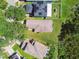 An aerial view of the rooftops and solar panels of homes, with lush greenery and quiet streets at 12716 Evington Point Dr, Riverview, FL 33579