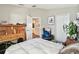 Bright bedroom with a high ceiling, a white comforter, and an open ensuite bathroom at 12716 Evington Point Dr, Riverview, FL 33579