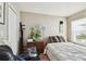 Comfortable bedroom featuring a large window, soft natural lighting, and neutral decor at 12716 Evington Point Dr, Riverview, FL 33579