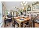 Dining area with wood table and access to living area at 12716 Evington Point Dr, Riverview, FL 33579