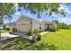 Charming single-story home featuring a well-manicured lawn and attached two-car garage at 12716 Evington Point Dr, Riverview, FL 33579
