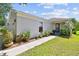 Charming single-story home featuring a well-manicured lawn and an inviting walkway at 12716 Evington Point Dr, Riverview, FL 33579