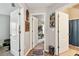 Hallway with three open doors leading to a bathroom, bedroom, and another room at 12716 Evington Point Dr, Riverview, FL 33579