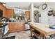 Functional kitchen featuring stainless steel appliances, a butcher block island, and tiled floors at 12716 Evington Point Dr, Riverview, FL 33579