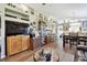 Spacious living room showcasing wood floors, ample display shelves, and natural light at 12716 Evington Point Dr, Riverview, FL 33579