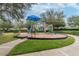 A colorful community playground featuring modern play equipment and ample space for children to play at 12716 Evington Point Dr, Riverview, FL 33579