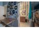 Bright bathroom features a single sink vanity, tiled floor, and quirky beaded doorway at 14116 Trouville Dr, Tampa, FL 33624