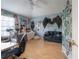 Quirky bedroom with decoratively accessorized walls, ceiling fan, and butterfly motif at 14116 Trouville Dr, Tampa, FL 33624