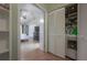 A bedroom with an open closet area that includes a washer and dryer at 14116 Trouville Dr, Tampa, FL 33624