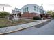 Exterior shot of Carrollwood Cultural Center with brick accents and a modern art sculpture on the lawn at 14116 Trouville Dr, Tampa, FL 33624