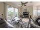 Spacious living area featuring sliding glass doors that provide plenty of natural light and access to the backyard at 14116 Trouville Dr, Tampa, FL 33624