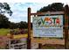 Entrance to Vista Gardens displaying the community garden's name and welcoming visitors to the sustainable agriculture center at 14116 Trouville Dr, Tampa, FL 33624