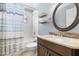 Well-lit bathroom featuring a vanity with dark wood cabinets and a shower-tub combo at 16104 Bridgedale Dr, Lithia, FL 33547