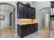 Stylish kitchen with wood cabinets, granite counters, and stainless steel appliances at 16104 Bridgedale Dr, Lithia, FL 33547