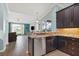 Kitchen with stainless appliances, granite countertops, and view to the living room at 16104 Bridgedale Dr, Lithia, FL 33547