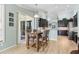 Bright kitchen with modern cabinetry, stainless steel appliances, and bar-style seating at 16104 Bridgedale Dr, Lithia, FL 33547