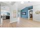 Bright open living space boasting wood floors, neutral paint and stylish archways to other rooms at 16104 Bridgedale Dr, Lithia, FL 33547