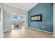 Open living area featuring wood floors and a sliding glass door to the screened-in patio at 16104 Bridgedale Dr, Lithia, FL 33547