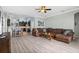 Spacious living room featuring a sectional sofa and open floor plan to the kitchen at 16104 Bridgedale Dr, Lithia, FL 33547