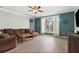 Inviting living room with a cozy sectional sofa, ceiling fan and natural light at 16104 Bridgedale Dr, Lithia, FL 33547