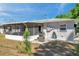 Charming backyard with screen lanai, patio with stainless steel grill, and tidy, well-maintained landscaping at 1732 63Rd N Ave, St Petersburg, FL 33702