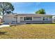Charming single-story home with a well-maintained lawn and attached single car garage at 1732 63Rd N Ave, St Petersburg, FL 33702