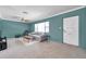 Comfortable living room featuring neutral colors, a ceiling fan, and a large window for ample natural light at 1732 63Rd N Ave, St Petersburg, FL 33702