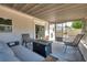 Relaxing screened patio with a fire pit and comfortable seating arrangement at 1732 63Rd N Ave, St Petersburg, FL 33702