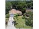 Aerial view of the house, driveway, and front yard landscaping at 1841 Georgia Ave, Palm Harbor, FL 34683