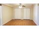Bedroom with a ceiling fan and large closets at 1841 Georgia Ave, Palm Harbor, FL 34683