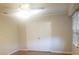 Bright bedroom with a ceiling fan, closet, and window at 1841 Georgia Ave, Palm Harbor, FL 34683