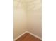 Empty closet featuring laminate flooring and a wire shelf storage system at 1841 Georgia Ave, Palm Harbor, FL 34683