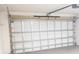 Interior view of a modern, paneled garage door in the garage at 1841 Georgia Ave, Palm Harbor, FL 34683