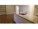 Kitchen island with granite countertops and stainless steel appliances, creating a modern look at 1841 Georgia Ave, Palm Harbor, FL 34683