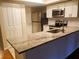 Renovated kitchen with stainless steel appliances and granite countertops at 1841 Georgia Ave, Palm Harbor, FL 34683
