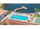 Aerial view of a sparkling blue pool with a community dock at 19029 Us Highway 19 N # 5-14, Clearwater, FL 33764