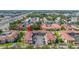 An aerial view of the community showing lush landscaping, tile roofs and ample parking at 19029 Us Highway 19 N # 5-14, Clearwater, FL 33764