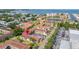 An aerial view of the community showing lush landscaping, tile roofs and water views at 19029 Us Highway 19 N # 5-14, Clearwater, FL 33764