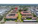 An aerial view of the community showing lush landscaping, tile roofs and ample parking at 19029 Us Highway 19 N # 5-14, Clearwater, FL 33764