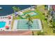 Aerial view of a shuffleboard court, putting green, and a blue pool at 19029 Us Highway 19 N # 5-14, Clearwater, FL 33764