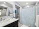 Bathroom featuring a stylish vanity and shower with tub at 19029 Us Highway 19 N # 5-14, Clearwater, FL 33764